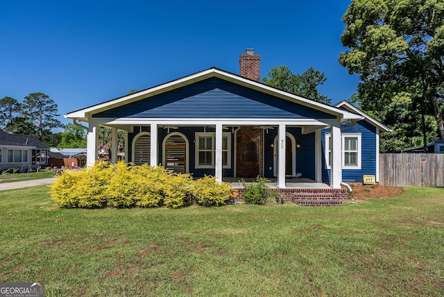 805 S Lee St, Fitzgerald, GA 31750 - ranch-style house featuring covered porch and a chimney