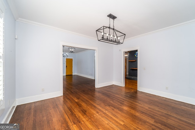 805 S Lee St, Fitzgerald, GA 31750 - spare room with a chandelier, ornamental molding, wood finished floors, and baseboards