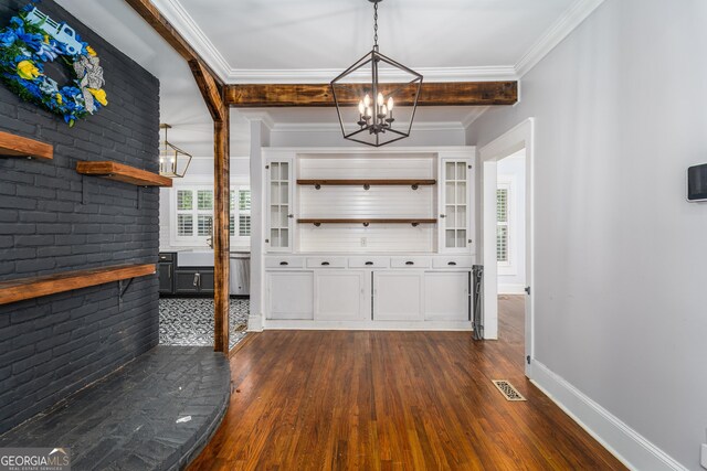 805 S Lee St, Fitzgerald, GA 31750 - entrance foyer featuring a chandelier, dark wood-style flooring, crown molding, and baseboards