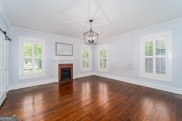 805 S Lee St, Fitzgerald, GA 31750 - unfurnished living room featuring a chandelier, healthy amount of natural light, baseboards, dark wood finished floors, and crown molding