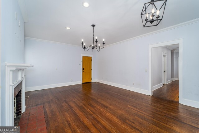 805 S Lee St, Fitzgerald, GA 31750 - unfurnished living room with a chandelier, crown molding, wood finished floors, a fireplace, and baseboards