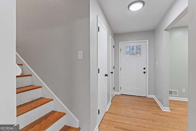 2002 Twin Falls Rd, Decatur, GA 30032 - foyer entrance featuring light wood-style floors, baseboards, and stairs