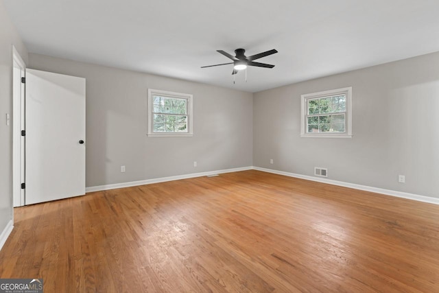 2002 Twin Falls Rd, Decatur, GA 30032 - empty room with healthy amount of natural light, light wood-type flooring, and baseboards