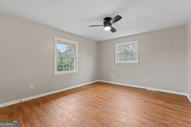 2002 Twin Falls Rd, Decatur, GA 30032 - unfurnished room with healthy amount of natural light, baseboards, and wood finished floors