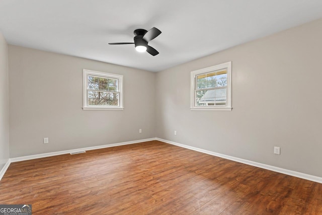 2002 Twin Falls Rd, Decatur, GA 30032 - spare room with healthy amount of natural light, wood finished floors, and baseboards
