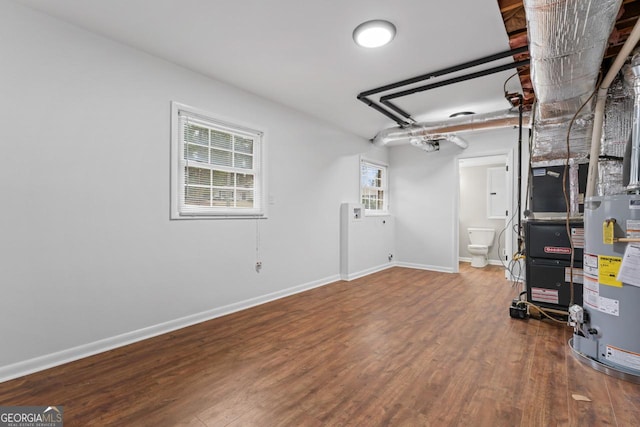 2002 Twin Falls Rd, Decatur, GA 30032 - below grade area with wood finished floors, gas water heater, and baseboards