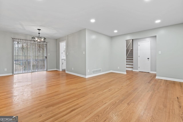 2002 Twin Falls Rd, Decatur, GA 30032 - unfurnished room featuring a chandelier, stairway, baseboards, light wood finished floors, and recessed lighting