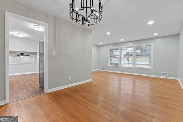2002 Twin Falls Rd, Decatur, GA 30032 - unfurnished dining area featuring light wood finished floors, a chandelier, baseboards, and recessed lighting