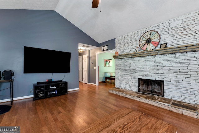 3908 Kilgore Falls Dr, Gainesville, GA 30507 - unfurnished living room with a ceiling fan, baseboards, high vaulted ceiling, a fireplace, and wood finished floors