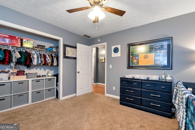 3908 Kilgore Falls Dr, Gainesville, GA 30507 - bedroom featuring light colored carpet, a textured ceiling, baseboards, a closet, and ceiling fan