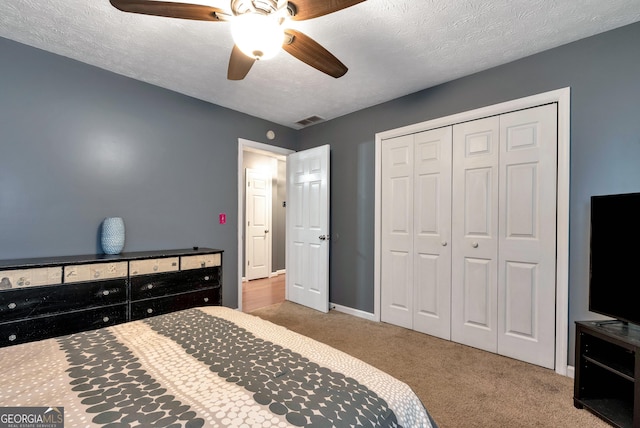 3908 Kilgore Falls Dr, Gainesville, GA 30507 - bedroom featuring carpet floors, a closet, a ceiling fan, baseboards, and a textured ceiling