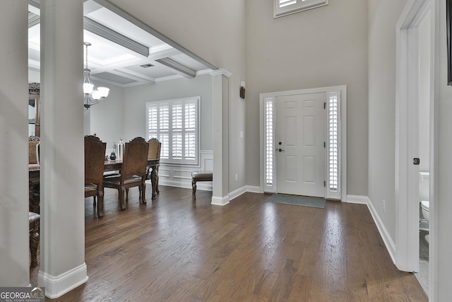 97 Senoya Ln, Senoia, GA 30276 - foyer featuring a chandelier, dark wood-type flooring, coffered ceiling, beam ceiling, and ornamental molding