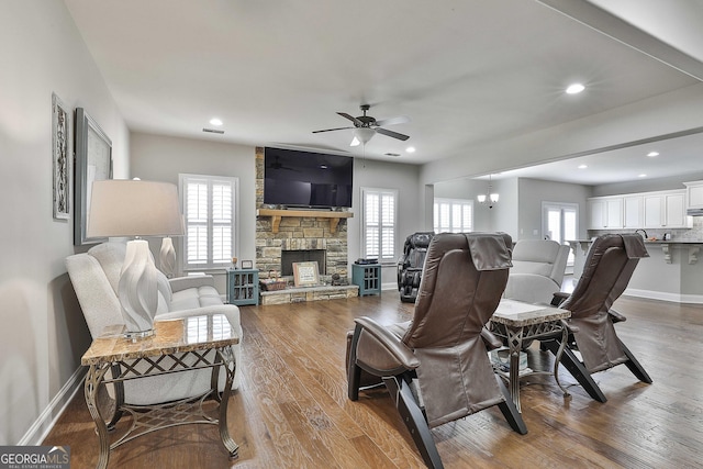 97 Senoya Ln, Senoia, GA 30276 - living area with a fireplace, wood finished floors, baseboards, ceiling fan, and recessed lighting