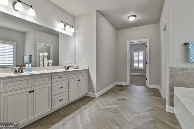 97 Senoya Ln, Senoia, GA 30276 - bathroom featuring double vanity, a bath, and baseboards