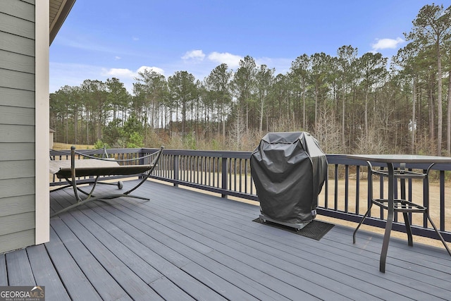 97 Senoya Ln, Senoia, GA 30276 - wooden deck with a grill and view of wooded area