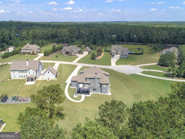 97 Senoya Ln, Senoia, GA 30276 - aerial view of property and surrounding area with a heavily wooded area