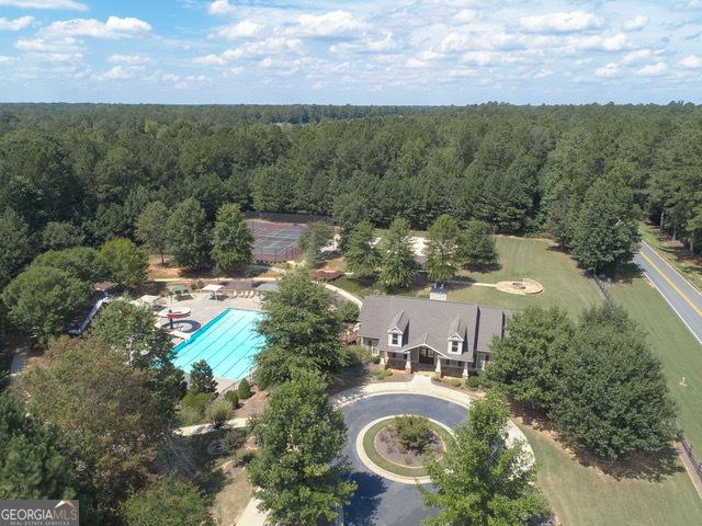 97 Senoya Ln, Senoia, GA 30276 - aerial view of a heavily wooded area and a pool