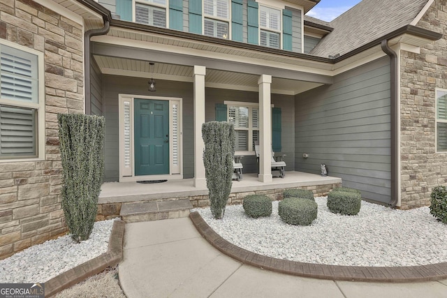 97 Senoya Ln, Senoia, GA 30276 - view of exterior entry featuring a porch and stone siding
