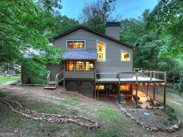 123 Old Fjord Rd, Blue Ridge, GA 30513 - rear view of property with a chimney and a wooden deck