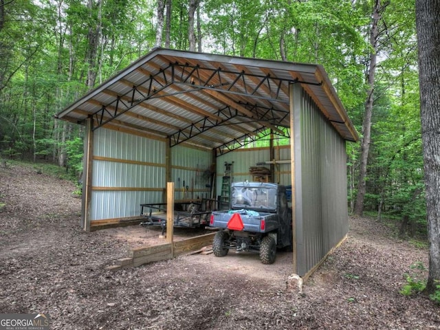 123 Old Fjord Rd, Blue Ridge, GA 30513 - view of pole building with a carport and a forest view