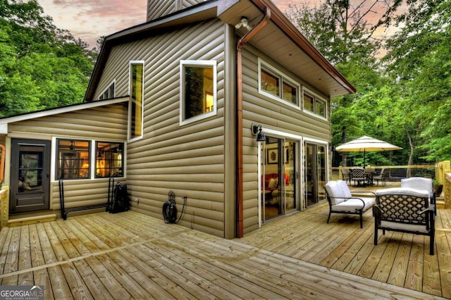 123 Old Fjord Rd, Blue Ridge, GA 30513 - deck at dusk featuring outdoor dining area