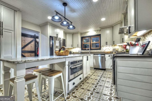 123 Old Fjord Rd, Blue Ridge, GA 30513 - kitchen with appliances with stainless steel finishes, tasteful backsplash, a breakfast bar, hanging light fixtures, and recessed lighting