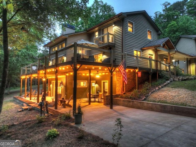 123 Old Fjord Rd, Blue Ridge, GA 30513 - back of house with a patio area, a chimney, and a balcony