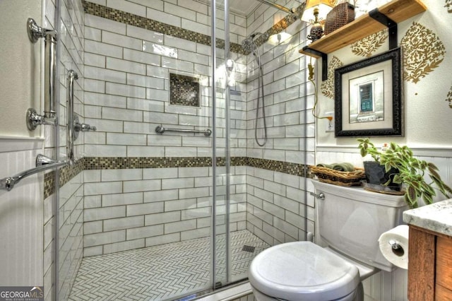 123 Old Fjord Rd, Blue Ridge, GA 30513 - full bath featuring toilet, a stall shower, vanity, and a wainscoted wall