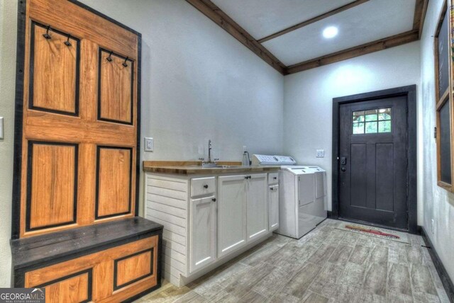 123 Old Fjord Rd, Blue Ridge, GA 30513 - laundry room featuring cabinet space, light wood finished floors, and washing machine and dryer