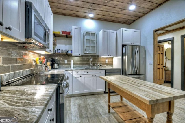 123 Old Fjord Rd, Blue Ridge, GA 30513 - kitchen with stainless steel appliances, wood ceiling, a sink, light wood-type flooring, and light stone countertops