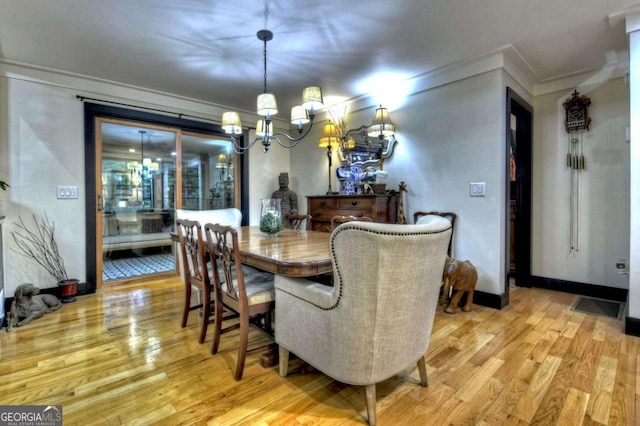 123 Old Fjord Rd, Blue Ridge, GA 30513 - dining area with a chandelier, light wood-type flooring, and ornamental molding