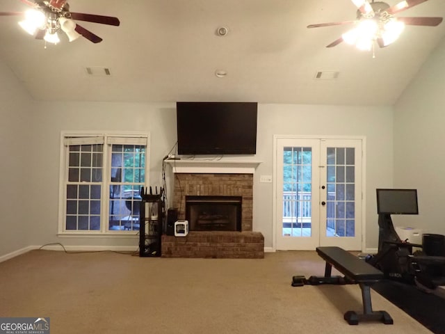185 Kinards Mill Rd, Jackson, GA 30233 - living area featuring ceiling fan, carpet floors, a fireplace, vaulted ceiling, and french doors