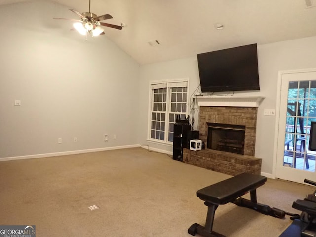185 Kinards Mill Rd, Jackson, GA 30233 - unfurnished living room featuring carpet floors, ceiling fan, a fireplace, healthy amount of natural light, and high vaulted ceiling