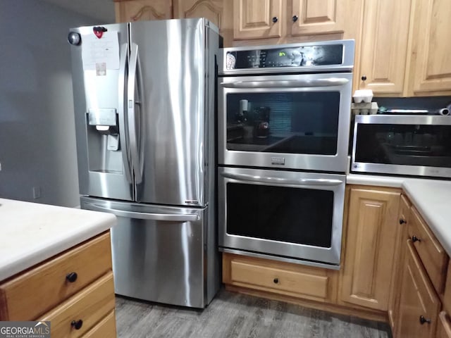 185 Kinards Mill Rd, Jackson, GA 30233 - kitchen with stainless steel appliances, light countertops, and light wood finished floors