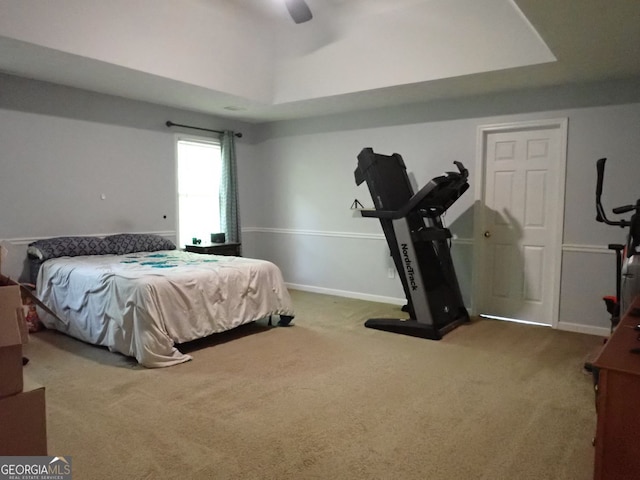 185 Kinards Mill Rd, Jackson, GA 30233 - carpeted bedroom featuring a tray ceiling and a ceiling fan