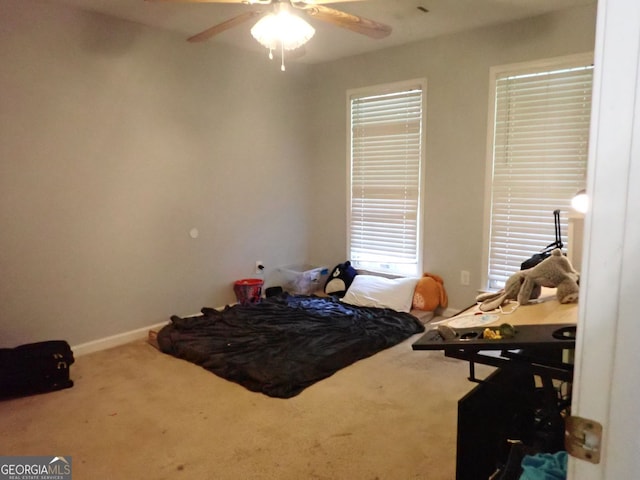 185 Kinards Mill Rd, Jackson, GA 30233 - carpeted bedroom featuring multiple windows and a ceiling fan