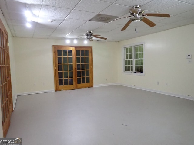 185 Kinards Mill Rd, Jackson, GA 30233 - empty room featuring a paneled ceiling, a ceiling fan, and finished concrete floors
