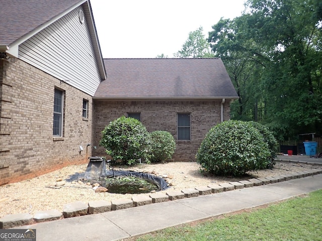185 Kinards Mill Rd, Jackson, GA 30233 - view of property exterior featuring brick siding and a shingled roof