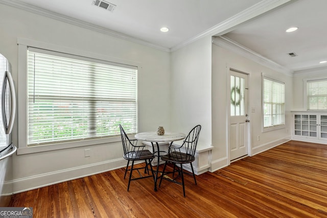 148 Jackson St, Newnan, GA 30263 - dining area with wood finished floors, baseboards, ornamental molding, and recessed lighting