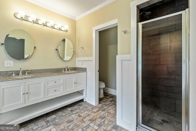 148 Jackson St, Newnan, GA 30263 - bathroom with a stall shower, double vanity, crown molding, and toilet