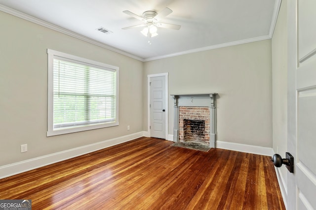 148 Jackson St, Newnan, GA 30263 - unfurnished living room featuring ornamental molding, a ceiling fan, a fireplace, wood finished floors, and baseboards