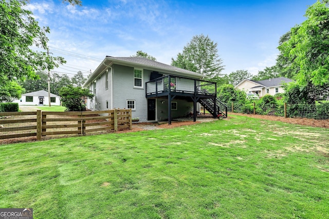 148 Jackson St, Newnan, GA 30263 - back of property with stairway, a deck, and brick siding