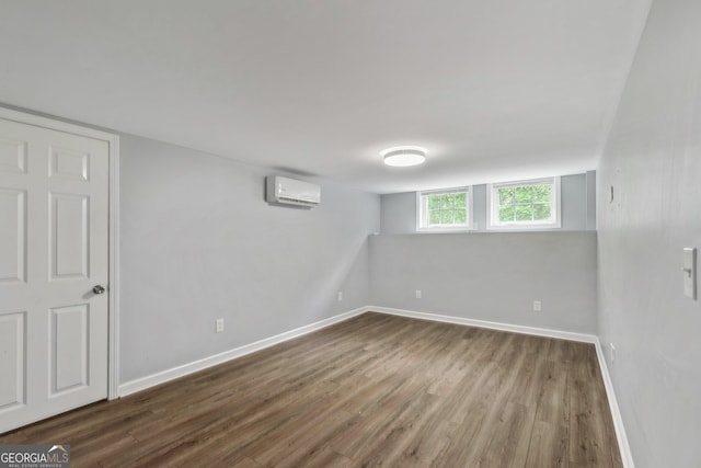 148 Jackson St, Newnan, GA 30263 - basement with a wall mounted AC, wood finished floors, and baseboards