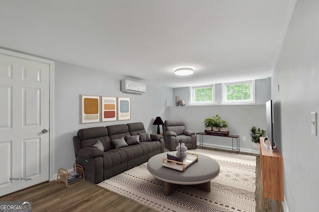 148 Jackson St, Newnan, GA 30263 - living room with a wall mounted air conditioner, wood finished floors, and baseboards
