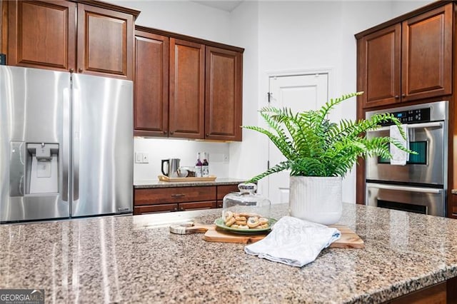 910 Ovalene Ln SW, Marietta, GA 30064 - kitchen featuring stainless steel appliances and light stone counters