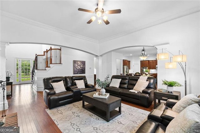 910 Ovalene Ln SW, Marietta, GA 30064 - living room with arched walkways, decorative columns, a ceiling fan, hardwood / wood-style floors, and ornamental molding