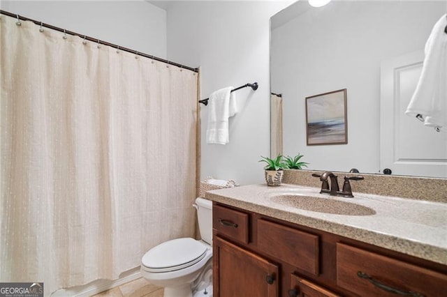 910 Ovalene Ln SW, Marietta, GA 30064 - full bath featuring toilet, vanity, a shower with shower curtain, and tile patterned flooring