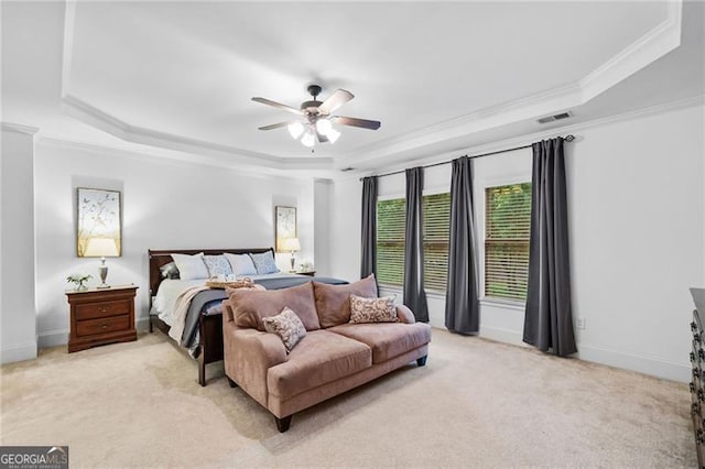 910 Ovalene Ln SW, Marietta, GA 30064 - bedroom featuring a tray ceiling, light colored carpet, ornamental molding, a ceiling fan, and baseboards