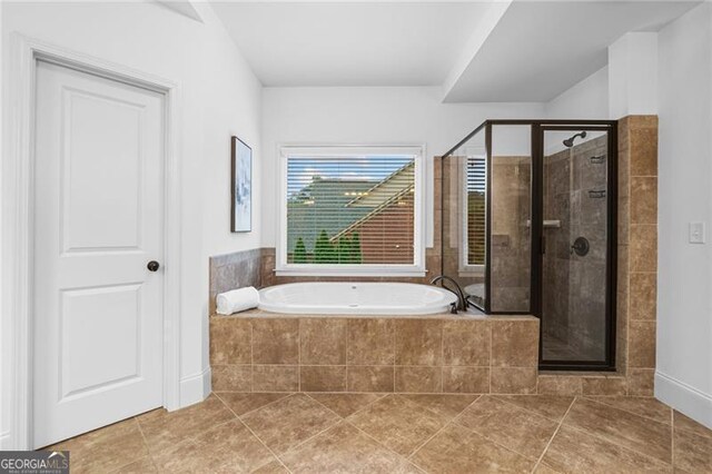 910 Ovalene Ln SW, Marietta, GA 30064 - bathroom with a bath, tile patterned flooring, and a shower stall