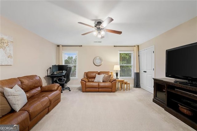 910 Ovalene Ln SW, Marietta, GA 30064 - carpeted living room with a ceiling fan, a desk, and baseboards